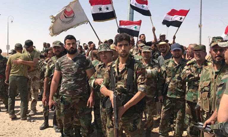 عناصر من الدفاع الوطني التابع لقوات النظام السوري في درعا (سبوتنيك)