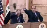 صورة تاريخية لحذاء العراقي منتظر الزيدي موجها إلى وجه جورج بوش جونيور