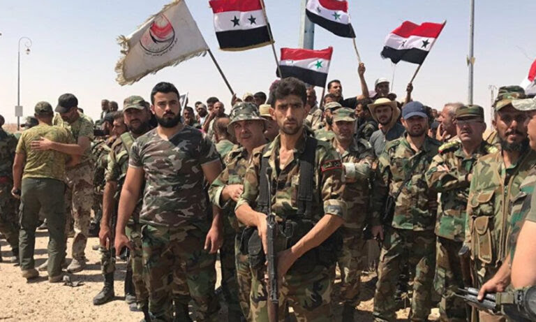 عناصر من الدفاع الوطني التابع لقوات النظام السوري في درعا (سبوتنيك)